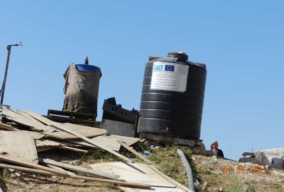 Water tanks at an illegal construction site in the Maale Adumim area, supplied by the humanitarian organization ACF and the European Union.